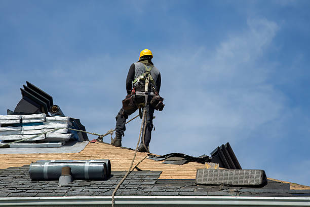 Professional Roof Replacement technician working in Bennett, IA